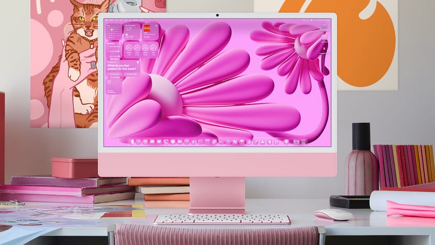 iMac running macOS Tahoe with pink desktop wallpaper